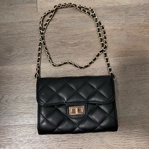 Cross body chain bag. Black and gold hardware.